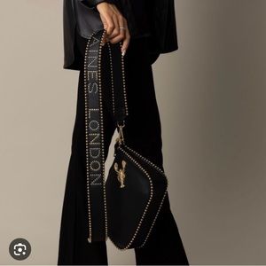 Elegant Black Shoulder Bag with Gold Detailing